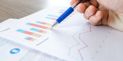 A data scientist interprets data on a report, showcasing the role of data