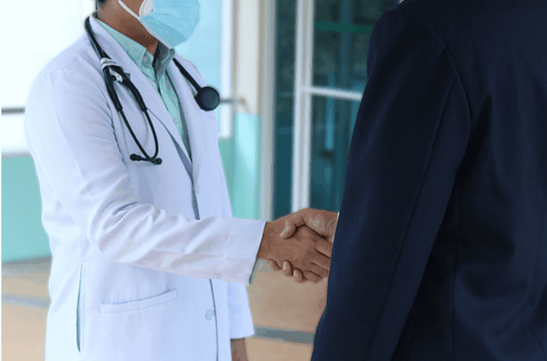 Handshake between a doctor and an applicant